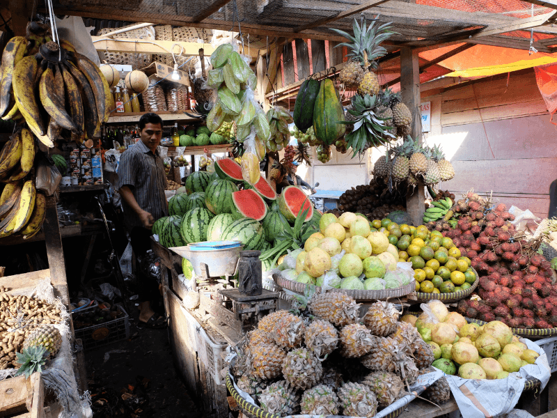 Bali Travel Tips: 5 Do’s And Dont'S To Know 10 Traditional Indonesian market with fresh tropical fruits like pineapples, watermelons, and starfruit
