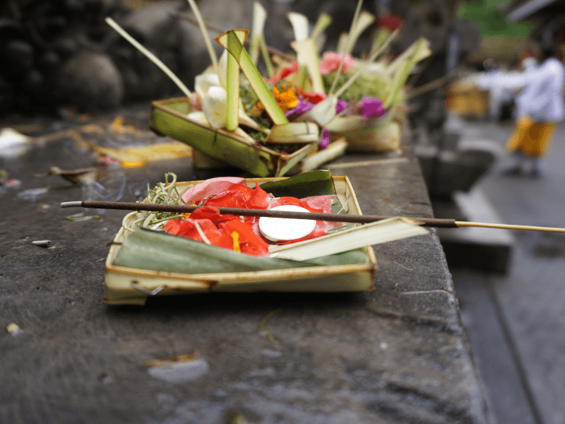 Bali Travel Tips: 5 Do’s And Dont'S To Know 13 Balinese daily offerings, known as canang sari, placed on a temple stone with incense and flowers